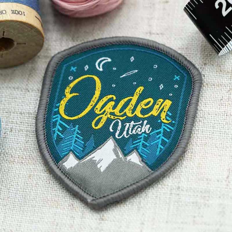 Custom woven patch with detailed linework